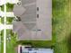 Aerial view of the home's roof and backyard showcasing a well-maintained lawn and neighborhood layout at 2502 Seven Oaks Dr, St Cloud, FL 34772