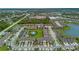 Community aerial shot highlighting neighborhood layout, amenities, landscaping and modern townhomes at 2502 Seven Oaks Dr, St Cloud, FL 34772