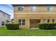 Backyard features a partially covered patio and healthy green grass at 2502 Seven Oaks Dr, St Cloud, FL 34772