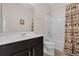 Bright bathroom featuring a shower/tub combo and dark wood vanity at 2502 Seven Oaks Dr, St Cloud, FL 34772