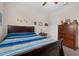 Bedroom has a ceiling fan, a window for natural light, and a spacious layout for plenty of furniture at 2502 Seven Oaks Dr, St Cloud, FL 34772