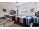 Bedroom with a ceiling fan, window for natural light, and plenty of room for furniture at 2502 Seven Oaks Dr, St Cloud, FL 34772