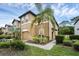 Beautiful townhome with a well-kept lawn, vibrant landscaping, and a cozy, inviting facade at 2502 Seven Oaks Dr, St Cloud, FL 34772
