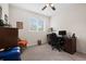 Cozy home office with computer desk, chair, and bright window with backyard view at 2502 Seven Oaks Dr, St Cloud, FL 34772