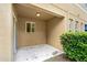 Covered patio space offering shade and view of the home's rear exterior and yard at 2502 Seven Oaks Dr, St Cloud, FL 34772