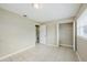 Bedroom featuring tile flooring, neutral walls, closet and doorway to another room at 26 Channing Ave, Orlando, FL 32811