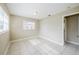 Bedroom featuring tile flooring, neutral walls, and a door with natural light at 26 Channing Ave, Orlando, FL 32811