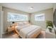 Bedroom featuring neutral walls, bedside tables, and a bed with a gray comforter at 26 Channing Ave, Orlando, FL 32811