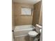 Bright bathroom features tiled shower and tub combination and a window at 2847 W Harwood St # 0, Orlando, FL 32805