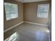 Bedroom featuring two windows allowing plenty of natural light at 2847 W Harwood St # 0, Orlando, FL 32805