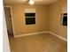 Neutral bedroom offers abundant natural light and ceramic tile floors at 2847 W Harwood St # 0, Orlando, FL 32805