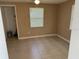 Bedroom with neutral paint, tile floors, and ceiling fan at 2847 W Harwood St # 0, Orlando, FL 32805