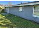 A single-story home with a stucco exterior and a well-maintained lawn showcases classic suburban charm at 2847 W Harwood St # 0, Orlando, FL 32805