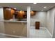 Functional kitchen featuring wood cabinetry and granite countertops is move-in ready at 2847 W Harwood St # 0, Orlando, FL 32805