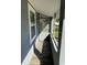 Enclosed side patio with gray paint, lattice design and wood plank floor at 2847 W Harwood St # 0, Orlando, FL 32805