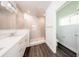 Bathroom with glass enclosed shower, granite counters and wood flooring at 300 Mitnik Dr, Deltona, FL 32738