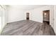 Bright bedroom with hardwood floors and plenty of natural light coming in from balcony door at 300 Mitnik Dr, Deltona, FL 32738