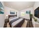 Modern bedroom featuring a stylish bed, decor, wood-look floors, and recessed lighting at 300 Mitnik Dr, Deltona, FL 32738