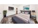 Modern bedroom with neutral tones, wood floors, and stylish staging at 300 Mitnik Dr, Deltona, FL 32738