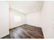 Bright, minimalist bedroom with hardwood floors and natural light at 300 Mitnik Dr, Deltona, FL 32738