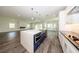 Bright kitchen features a large island with stainless steel appliances and plenty of counter space at 300 Mitnik Dr, Deltona, FL 32738