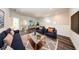 Inviting living space with modern furnishings, hardwood floors, and ample room for relaxation at 300 Mitnik Dr, Deltona, FL 32738