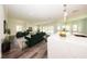 Spacious living room with modern furnishings, open floor plan, and bright natural lighting at 300 Mitnik Dr, Deltona, FL 32738