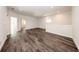 Large living area features modern hardwood flooring and offers generous open space at 300 Mitnik Dr, Deltona, FL 32738