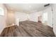 Expansive loft with natural lighting and stylish gray wood flooring at 300 Mitnik Dr, Deltona, FL 32738