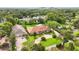 Aerial view of estate showcasing the mature landscaping, circular drive, and red tile roof at 3215 Greens Ave, Orlando, FL 32804