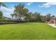 Spacious backyard with lush green grass and mature trees, perfect for outdoor activities at 3215 Greens Ave, Orlando, FL 32804