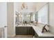 Bathroom with a decorative chandelier, vanity and an oversized mirror with plenty of counter space at 3215 Greens Ave, Orlando, FL 32804