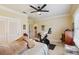 Comfortable bedroom with a ceiling fan, neutral colors, and plenty of space at 3215 Greens Ave, Orlando, FL 32804