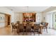 Traditional dining room featuring hardwood table, elegant chandelier, and built-in display cabinet at 3215 Greens Ave, Orlando, FL 32804