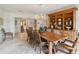Charming dining room featuring a large wood table, decorative chandelier, and built-in hutch at 3215 Greens Ave, Orlando, FL 32804