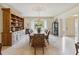 Elegant dining room featuring hardwood table, chandelier, built-in cabinet, and marble flooring at 3215 Greens Ave, Orlando, FL 32804