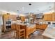Large kitchen with stainless steel appliances, wood cabinets, and a kitchen island at 3215 Greens Ave, Orlando, FL 32804