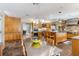 Bright, open kitchen with stainless steel appliances, a large island, and wood cabinetry at 3215 Greens Ave, Orlando, FL 32804