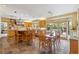 Large kitchen features wood cabinets, stainless appliances, a spacious island, and access to the backyard at 3215 Greens Ave, Orlando, FL 32804