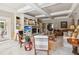 Open-concept living room featuring a fireplace, built-in shelves, and comfortable seating at 3215 Greens Ave, Orlando, FL 32804
