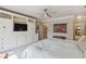 Large bedroom with white built in cabinetry, a ceiling fan and plenty of room at 3215 Greens Ave, Orlando, FL 32804