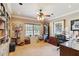Office with custom built-in shelving, a ceiling fan, and natural light at 3215 Greens Ave, Orlando, FL 32804