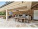 Relax on your lanai, that includes a dining area, grilling station and a view of a manicured backyard with a pool at 3215 Greens Ave, Orlando, FL 32804
