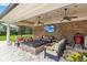 Covered outdoor space perfect for relaxing, with outdoor seating, fire pit, and a TV at 3215 Greens Ave, Orlando, FL 32804