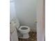 Bathroom featuring a toilet, gold fixtures, and geometric tiles, and white trim at 3305 Robinson St, Zellwood, FL 32798