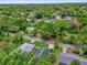 An aerial view of a residential neighborhood with tree-lined streets and well-kept lawns at 339 Chinaberry Ave, Oviedo, FL 32765