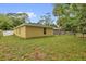 View of the backyard featuring a well-maintained lawn, privacy fence and room for outdoor activities at 339 Chinaberry Ave, Oviedo, FL 32765
