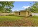 View of the backyard featuring a well-maintained lawn and partial fencing at 339 Chinaberry Ave, Oviedo, FL 32765