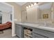 Bathroom features double sinks, gray cabinetry, and storage shelves, accented by neutral walls and bright lighting at 339 Chinaberry Ave, Oviedo, FL 32765