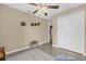 Comfortable bedroom featuring tile floors, ceiling fan, and ample closet space in a bright setting at 339 Chinaberry Ave, Oviedo, FL 32765